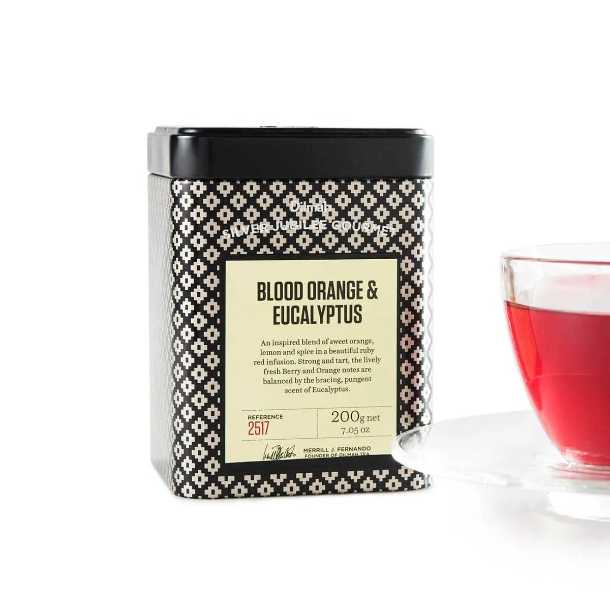 Tin of loose leaf Blood Orange & Eucalyptus tea, with a cup of tea