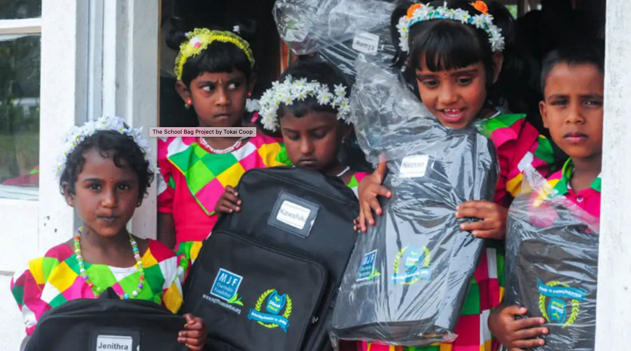Kids plantage workers receive schoolbag
