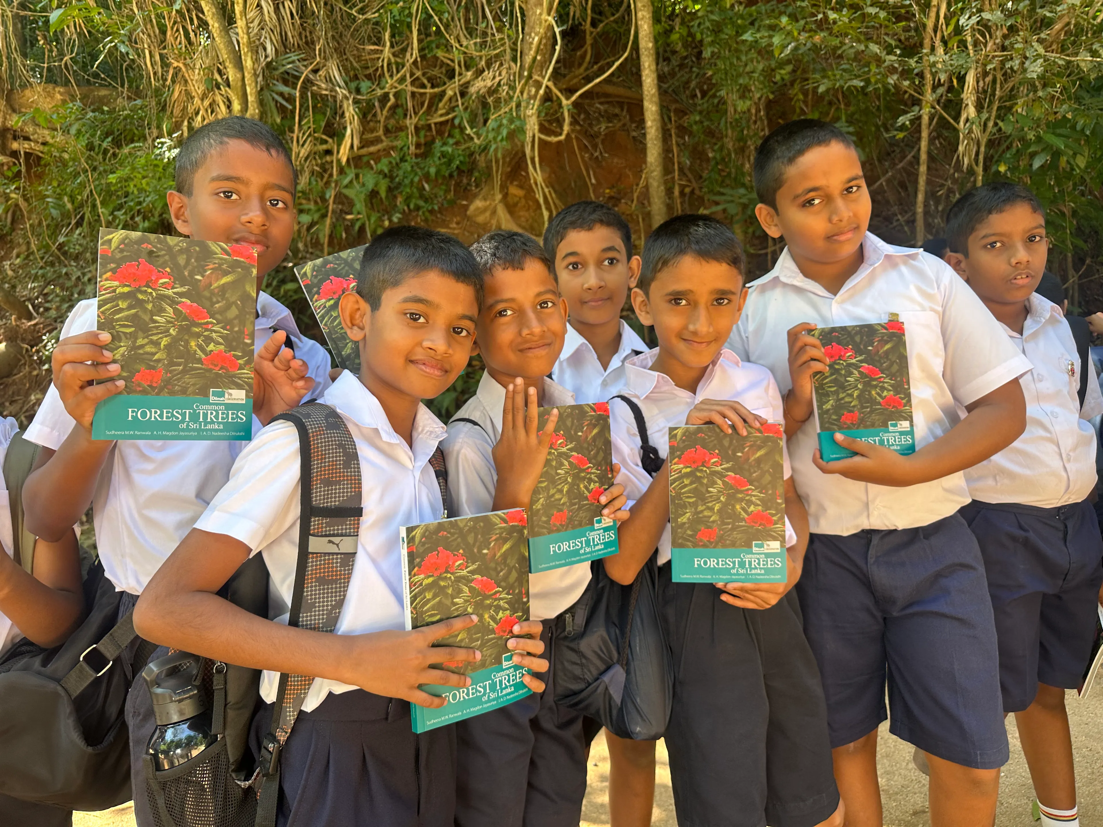 Scholars with their books about nature, given by Dilmah