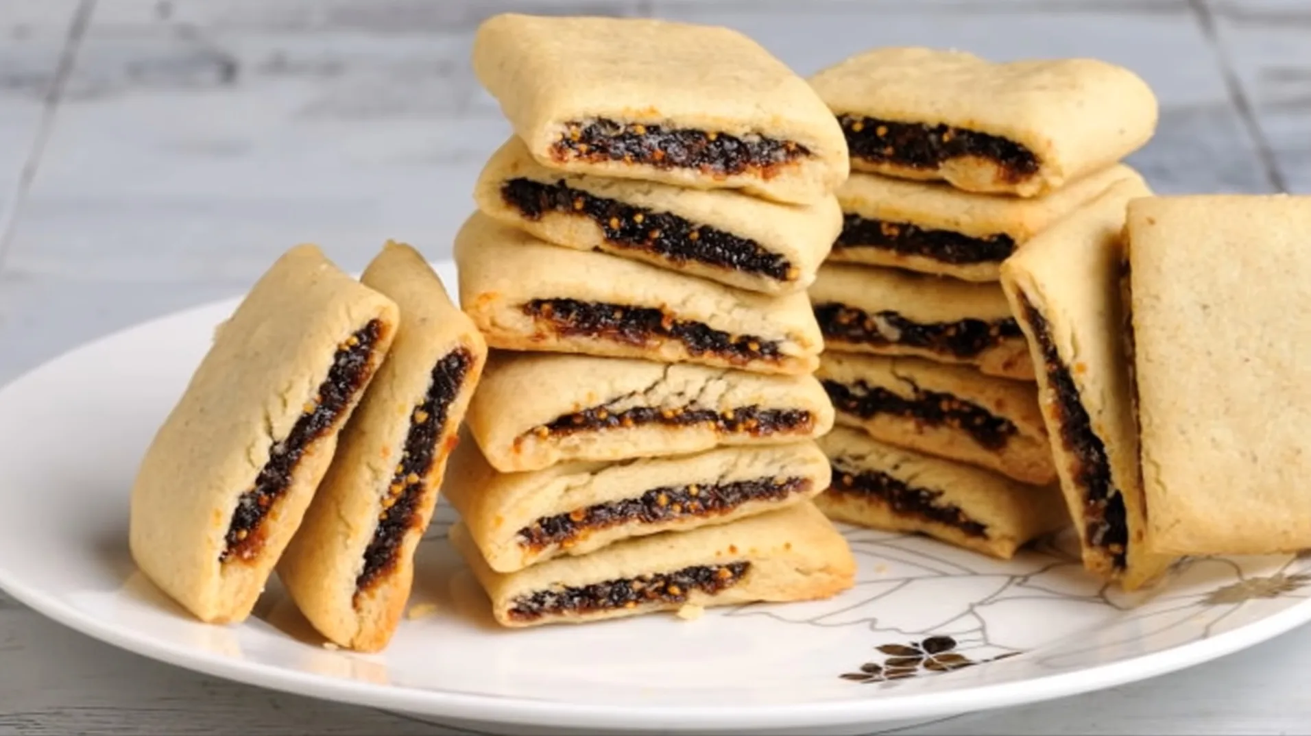fig paste filled cookies piled on a plate